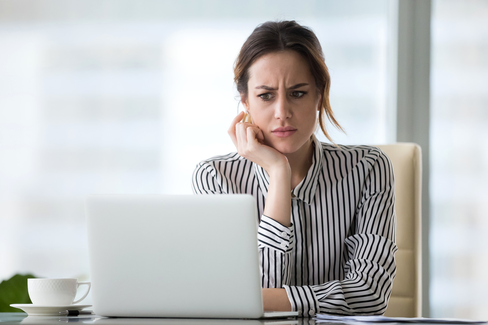 Businesswoman concerned about business email compromise